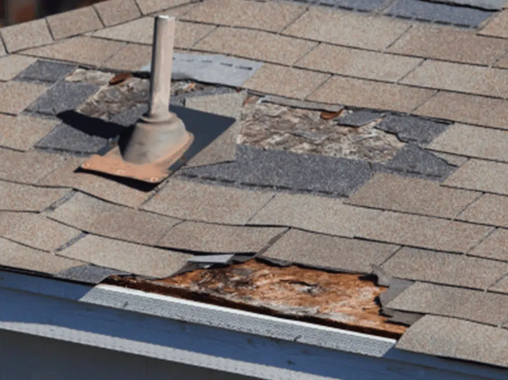 Damaged and missing shingles on a roof