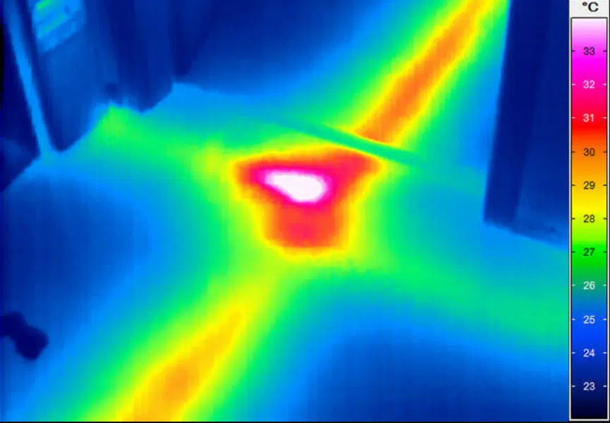 Thermal image showing a hot spot along a pipe
